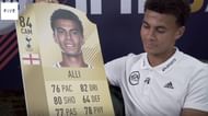 Dele Alli on Rio Ferdinand's YouTube channel, holding his rating card